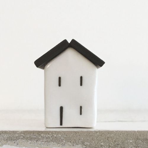 Porcelain house with wooden roof