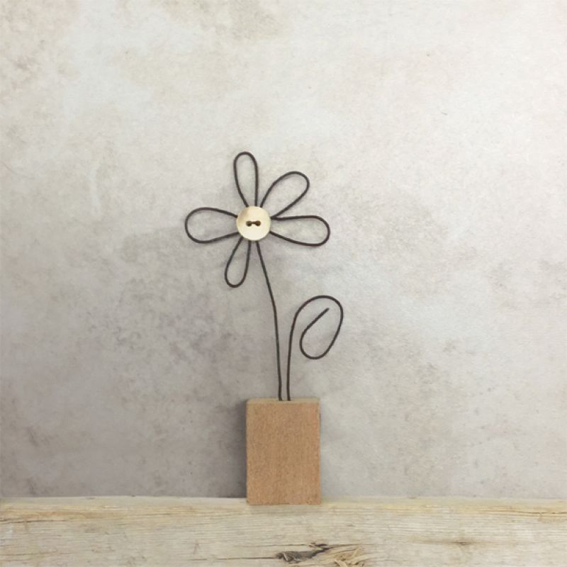 Wire flower in wooden block