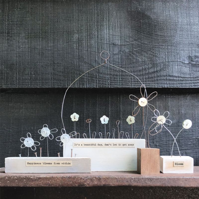 Wire flower in wooden block