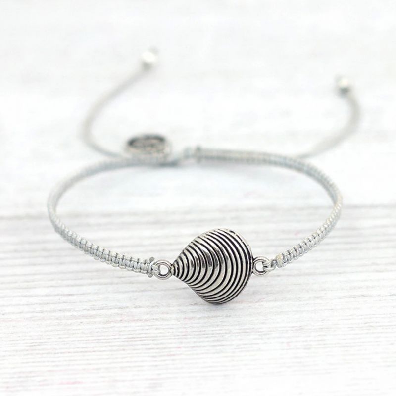 Handwoven bracelet with charm