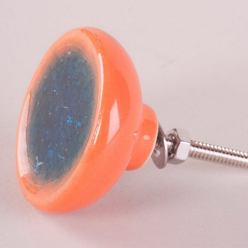 Teal/orange ceramic door knob with crackle glaze
