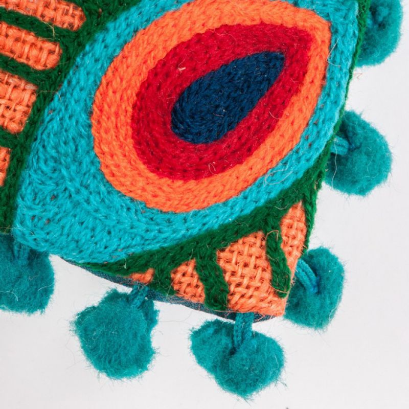 Peacock cushion with green pom poms
