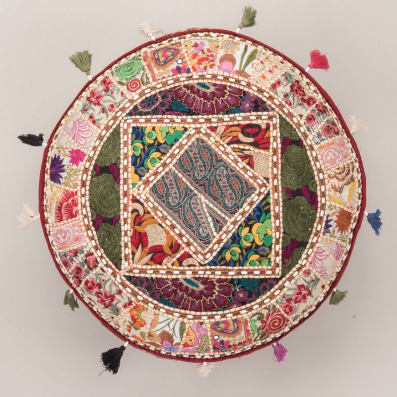 Patchwork pouffe made from old embroideries